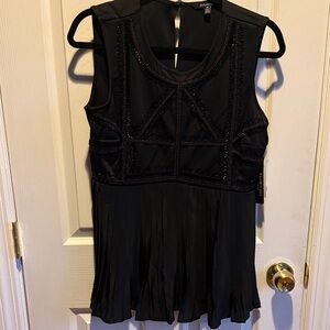 Eva Longoria Black Sleeveless shirt with beaded details